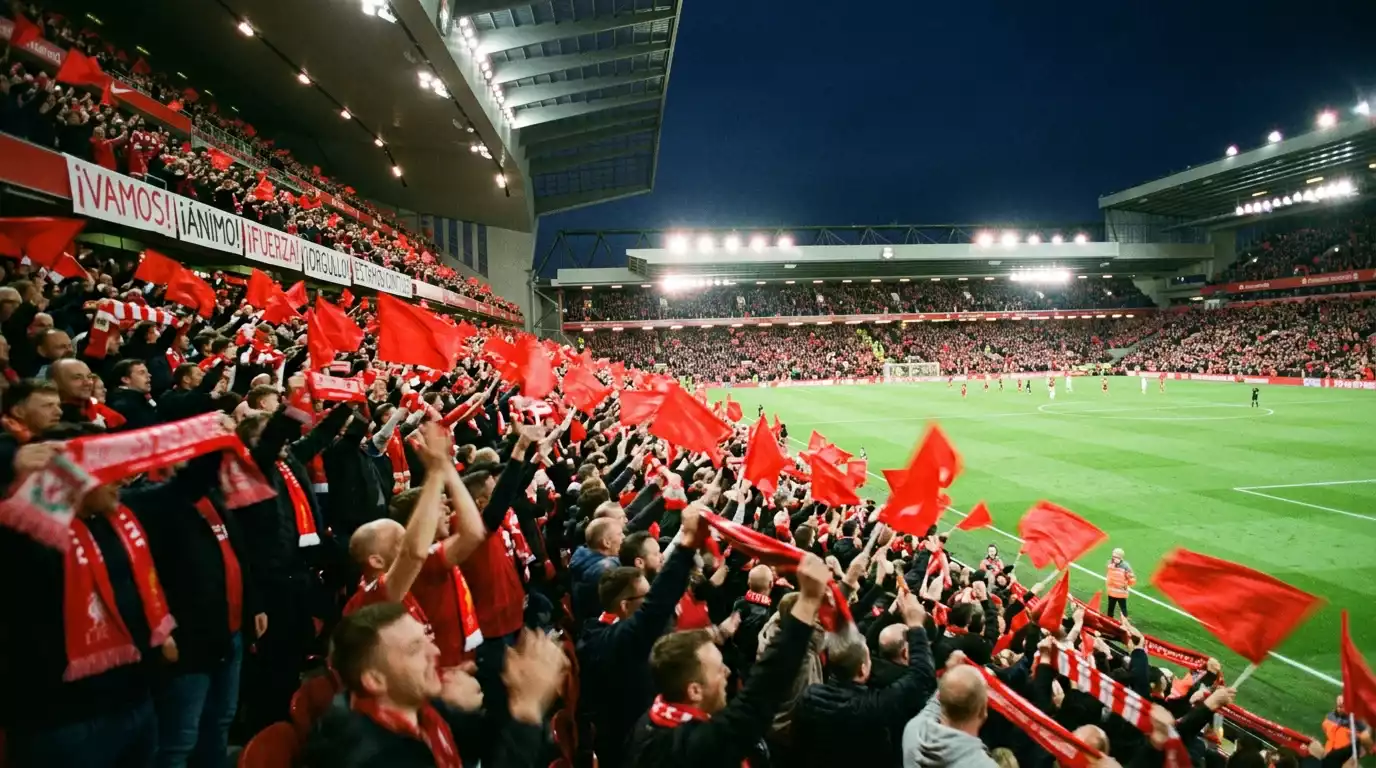 Aficionados con bufandas rojas celebrando un título en las gradas de un estadio de fútbol japonés